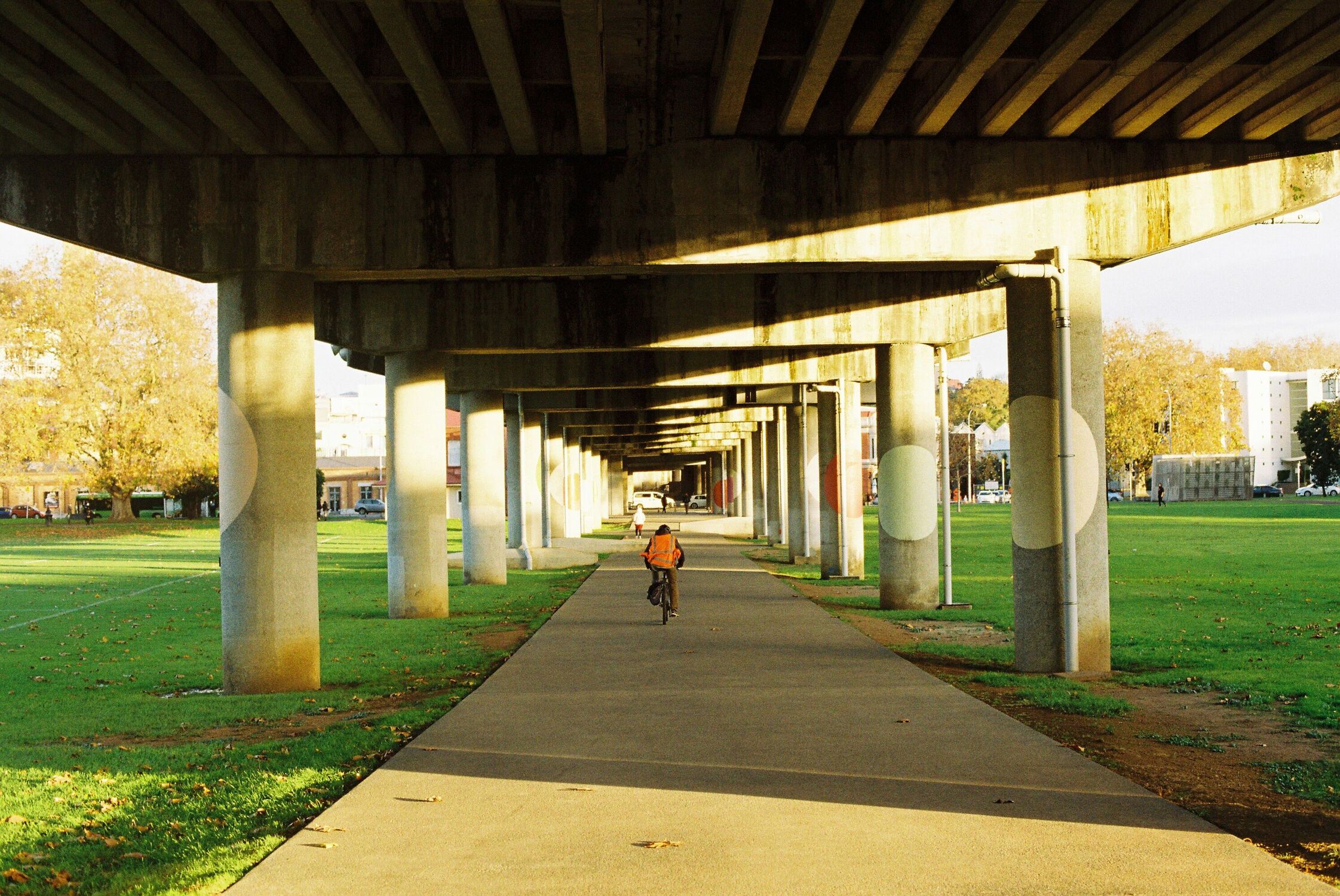 A tunnel underneath a bridge that gets smaller and smaller as it goes toward the centre of the frame