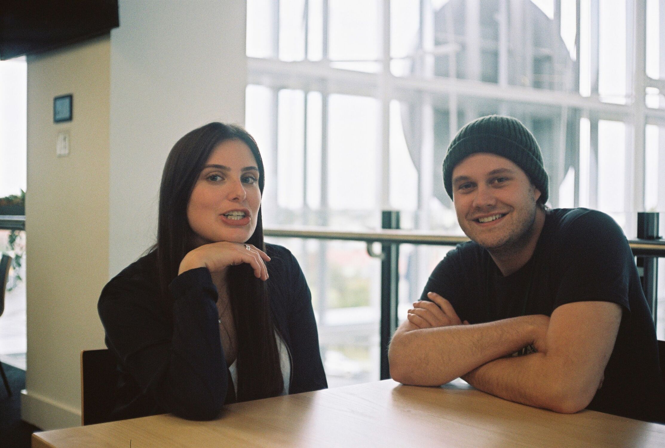 Two people sitting at a cafe (Jono on the right)