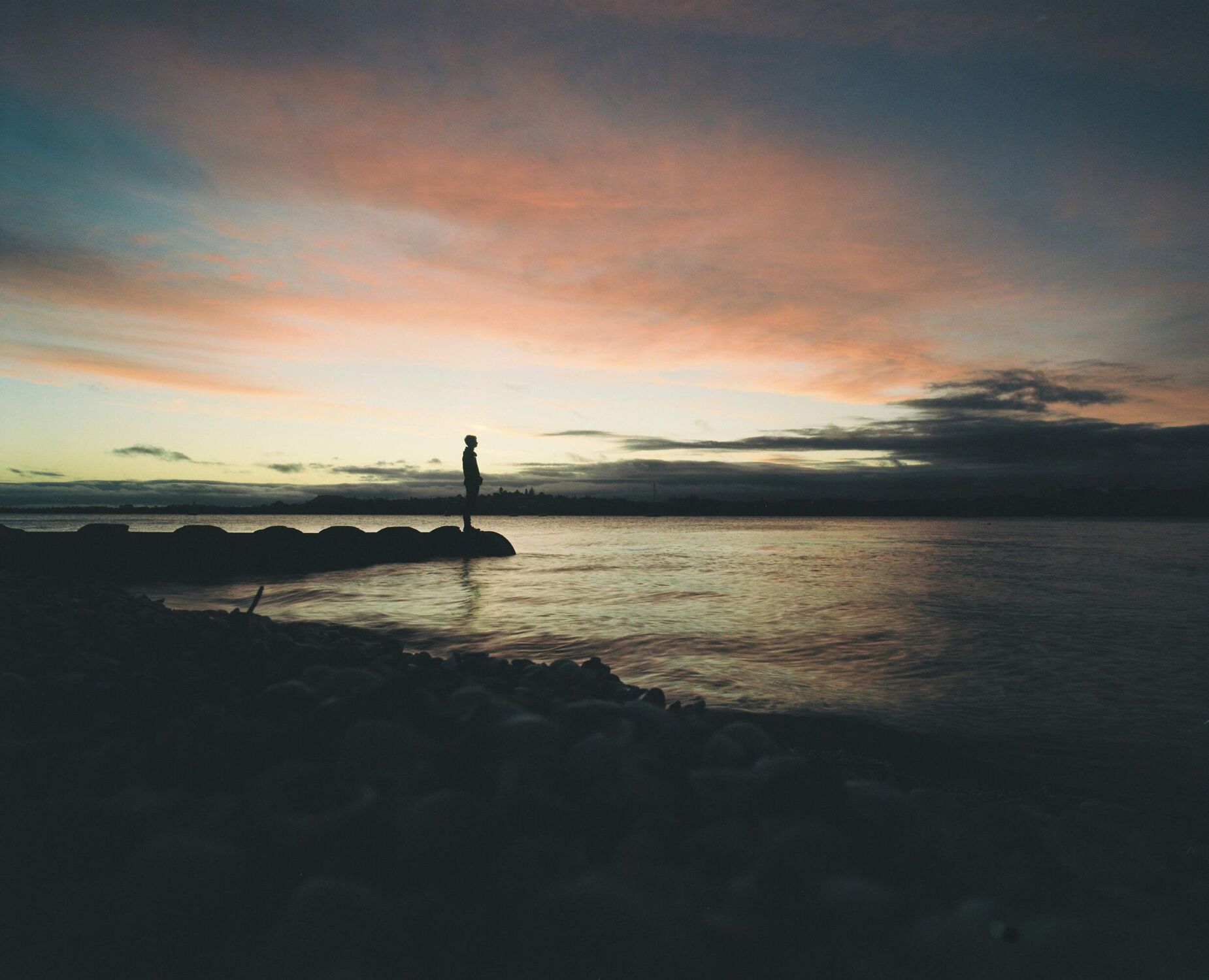 Silhouette of a man against the setting sun