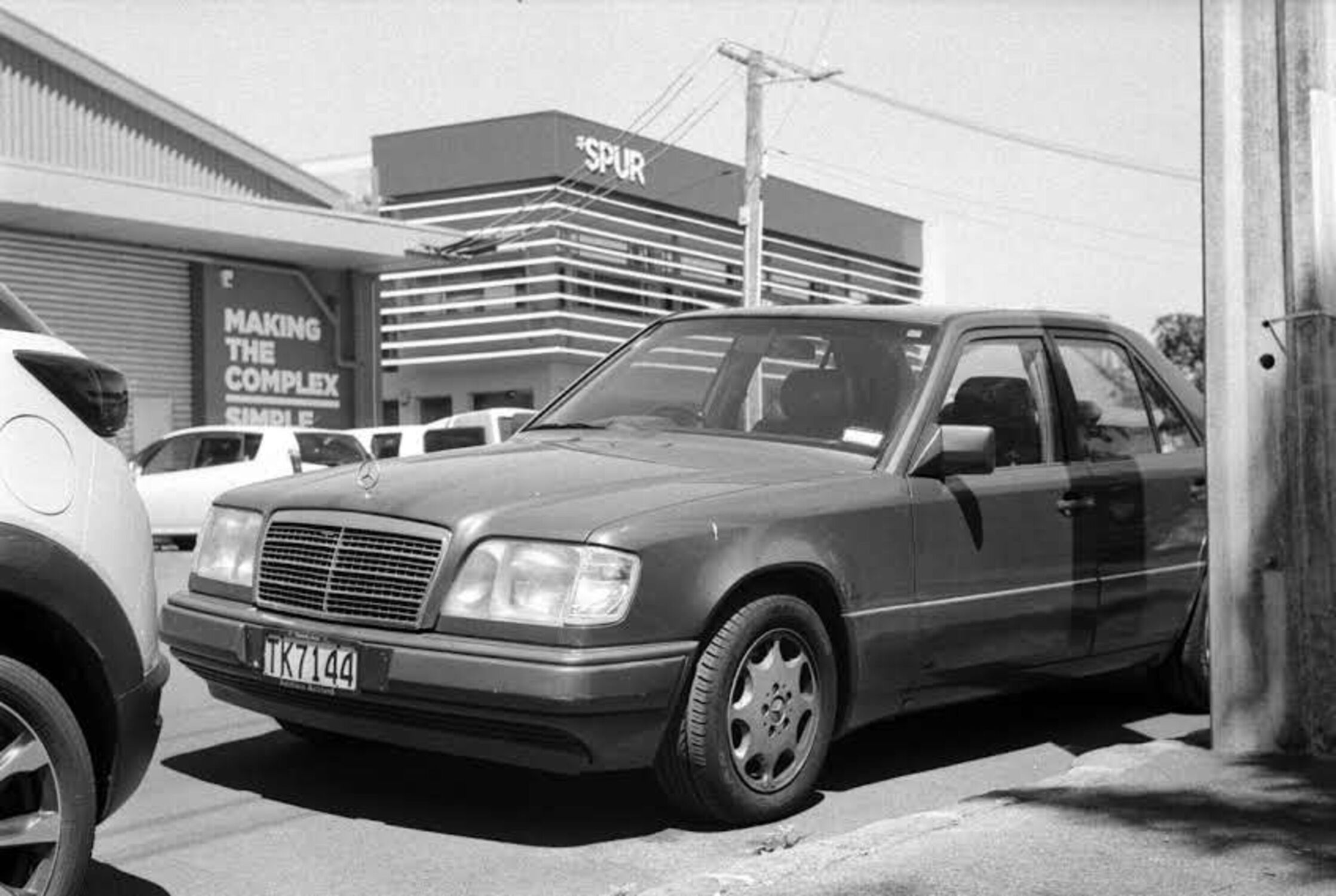 Older Mercedes car sitting in the sun